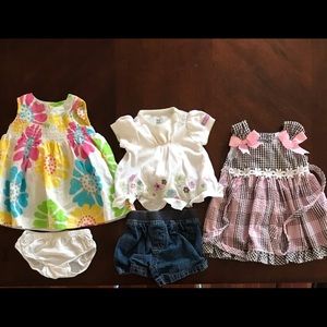 Baby girl dresses and warm weather blouse and jean shorts.